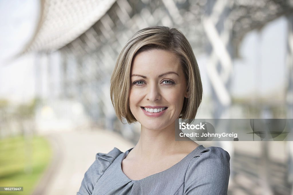 Businesswoman Smiling Portrait of an attractive mid adult businesswoman smiling. Human Face Stock Photo