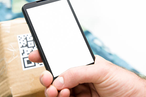 istock Hand holding smart phone and checking price with QR 185273149