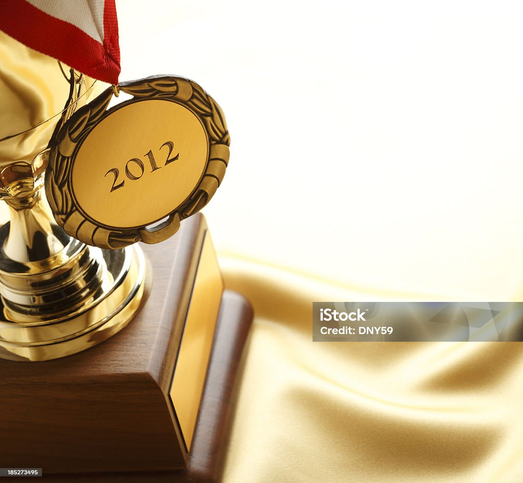 Medal and Trophy "A gold medal hanging on a trophy with 2012 engrave on the medalTo see a 2013 version, click on the link below:" Achievement Stock Photo