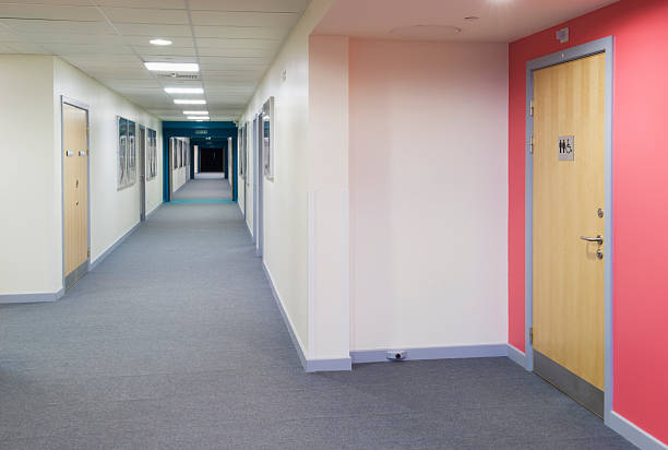 Modern secondary school corridor Looking along a corridor in a modern secondary school. public restroom photos stock pictures, royalty-free photos & images