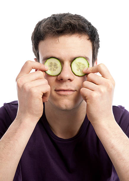 istock Young man with facial mask 185274122