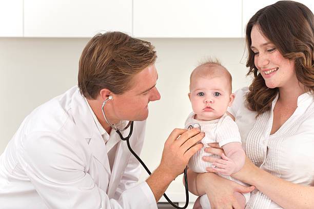 istock Doctor examining a baby 185274265