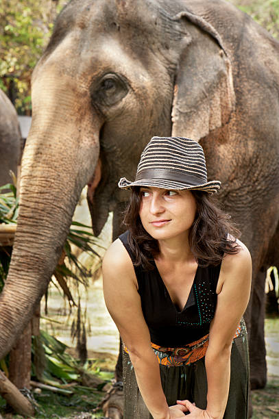 istock Woman and Elephants 185274267