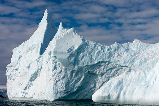 Huge iceberg close to the shores of Shetland Islands.