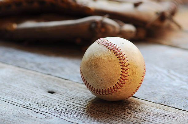 istock Baseball and glove on rustic wood 185274586