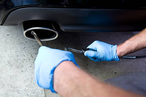 Smog Testing Mechanic smog testing car. CLICK TO SEE MORE! smog check stock pictures, royalty-free photos & images