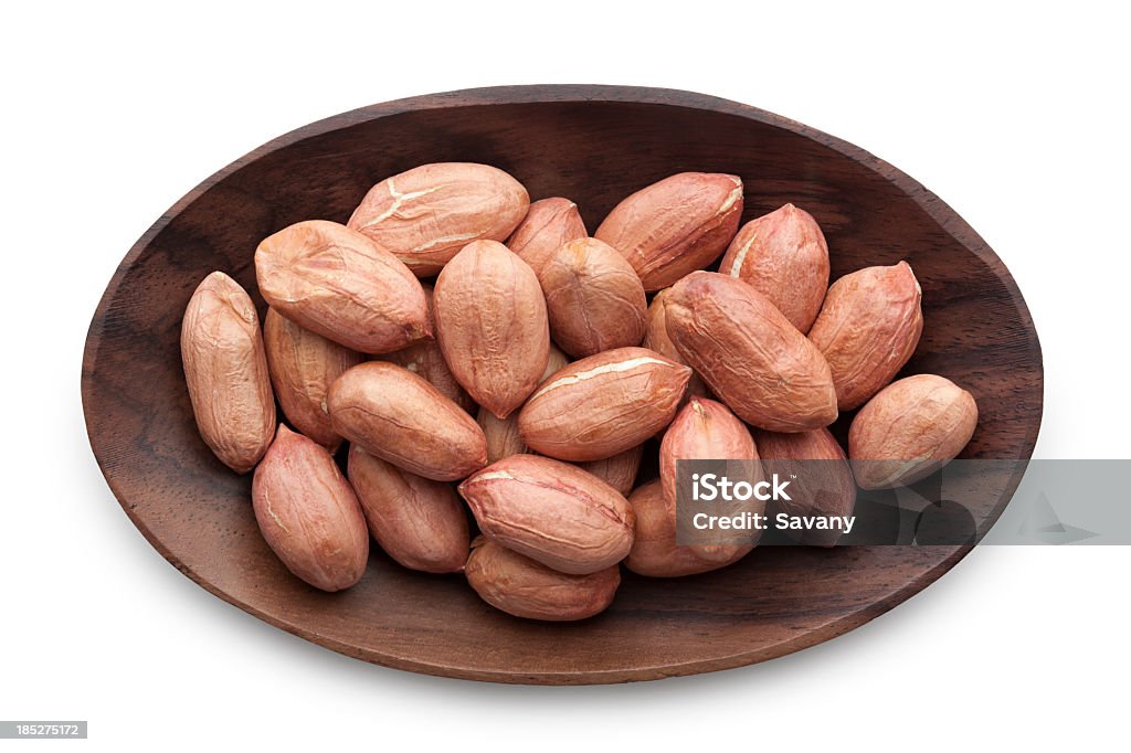 Almond Roasted almond photographed in heap in wooden bowl Almond Stock Photo