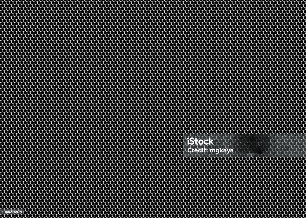 Honeycomb Grille Mesh Metallic honeycomb (hexagon) grille mesh on black background. Hexagon Stock Photo
