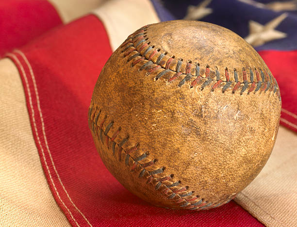Antique baseball close-up on USA flag