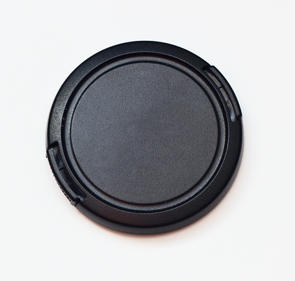 lens adapter and cap on a white background. Copy space.