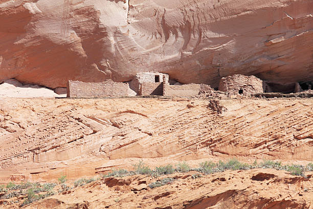 Navajo settlements in rock wall at Canyon de Chelly ancient Indian Navajo settlements in rock at Canyon de Chelly chinle arizona stock pictures, royalty-free photos & images