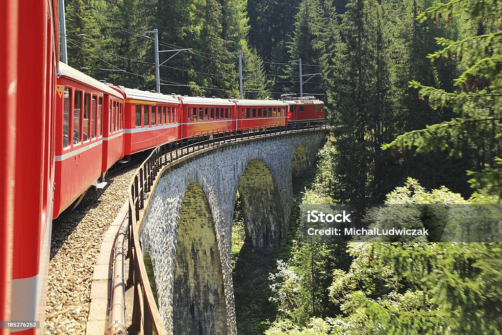 Swiss railways Swiss train travels at a stone viaduct Switzerland Stock Photo