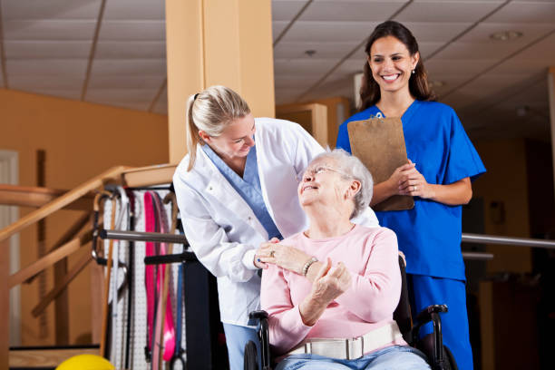 istock Senior woman with physical therapists 185276371