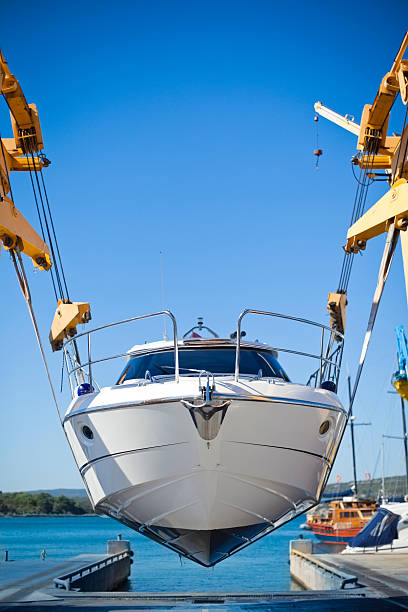 motor yacht launch "new modern motor yacht launch in the shipyard, copy spaceCHECK OTHER SIMILAR IMAGES IN MY PORTFOLIO...." dry dock stock pictures, royalty-free photos & images