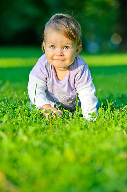 istock Girl Crawling in Grass 185276920