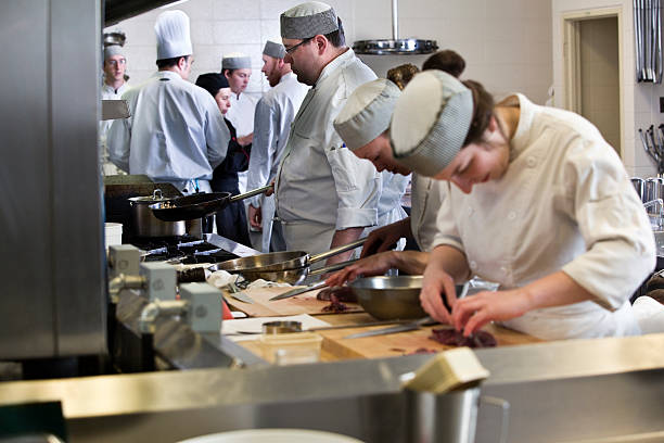 istock Group of cooks working in a industrial kitchen 185277240