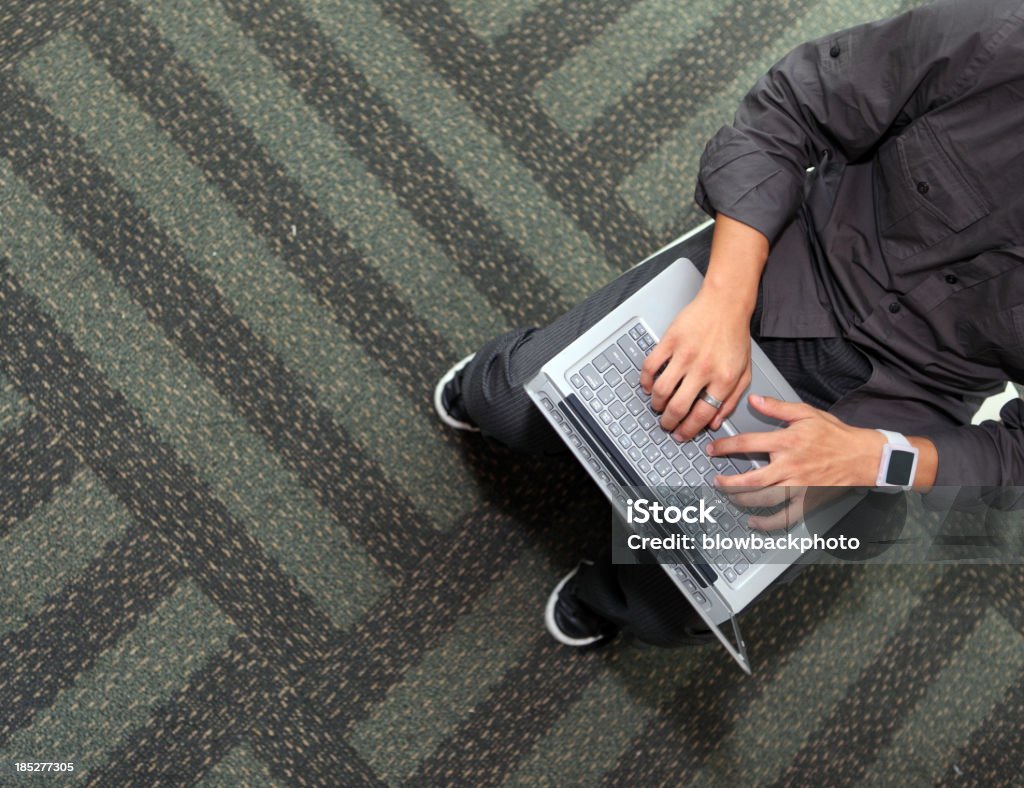 Man Using an Ultrabook Style Laptop A man using a thin ultrabook-style computing device. Adult Stock Photo
