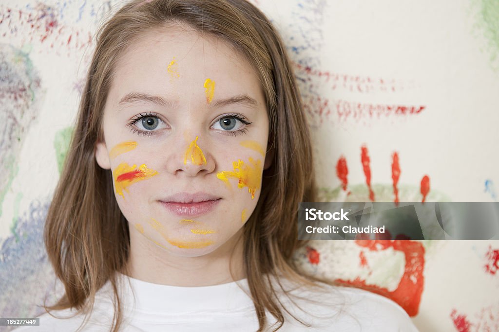 Young artist Teenage girl with paint in faceMore photos of that girls and family: Adult Stock Photo