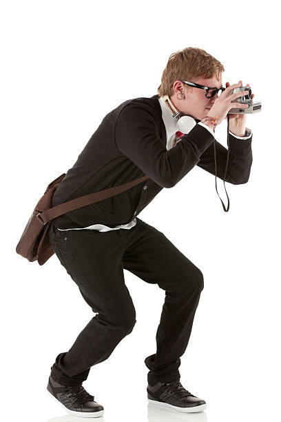 istock Man taking picture with a polaroid camera 185277519
