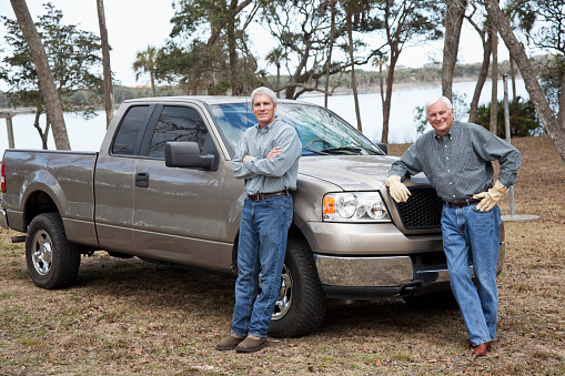 Two men with pickup truck.
