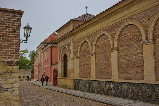 Prague, Czech Republic - October 8, 2023: A fragment of the old brick fortress wall on Stulcova Street. Vysehrad Prague. Romantic atmosphere at any time of the year. Ancient and colorful streets.