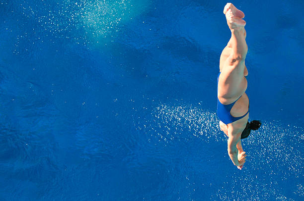 istock Diver plunging straight down toward the water 185278716