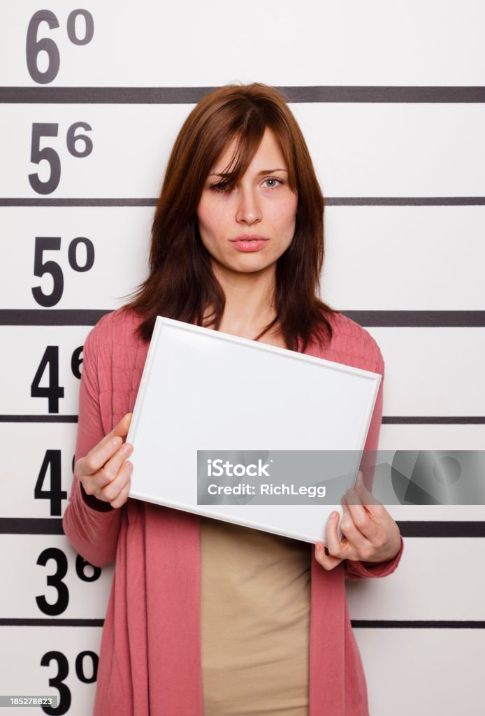 Mugshot of a Woman A mugshot/booking photo of a woman. Prison Stock Photo