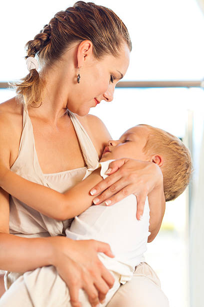 istock Unconditional love - Mother embracing her sleeping son 185278887