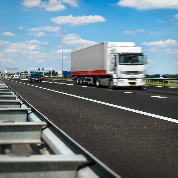 Speeding truck on dutch highway stock photo