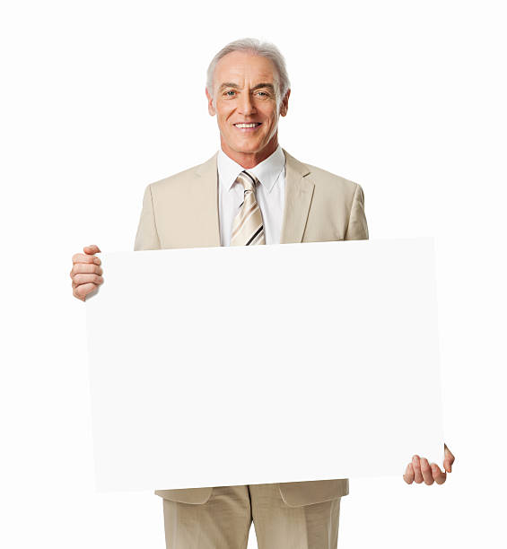istock Mature Businessman Holding Blank Sign - Isolated 185279094