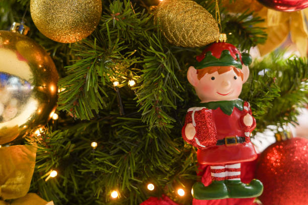 istock Christmas Elf with golden and red decorations on the Christmas tree 1852795547
