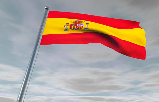 Spanish Flag on a Cloudy Sky