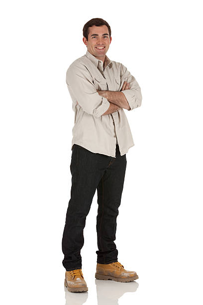 istock Happy man standing with his arms crossed 185279890