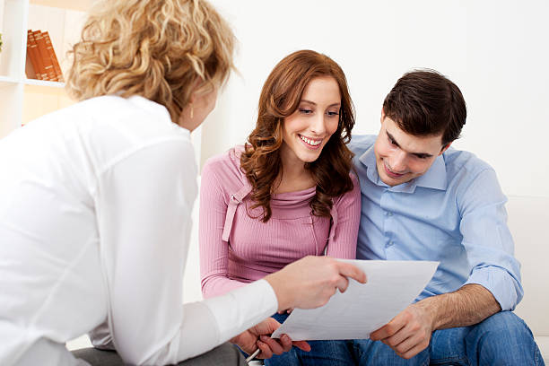 istock Couple Meeting With Financial Advisor 185279928