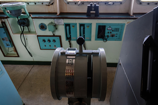 Navigational bridge and control device on old abandoned ship.