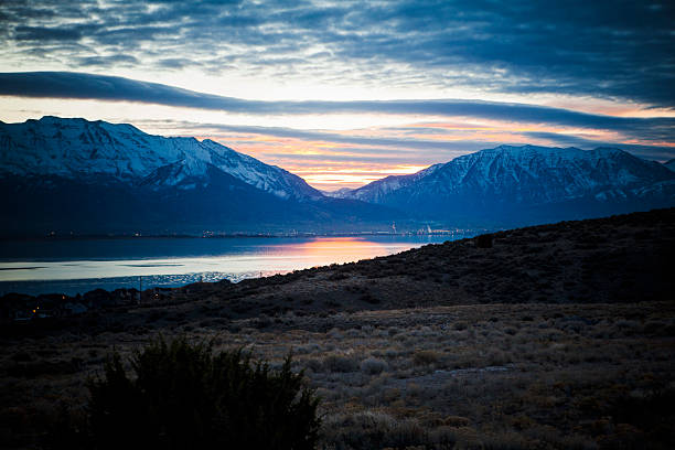 Sunrise Over Utah Lake Utah Lake and Wasatch Mountains lake utah stock pictures, royalty-free photos & images