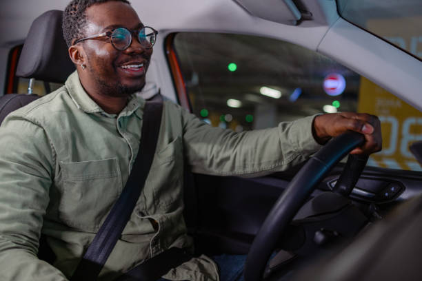 istock A man with a fastened seat belt driving a car 1852806662