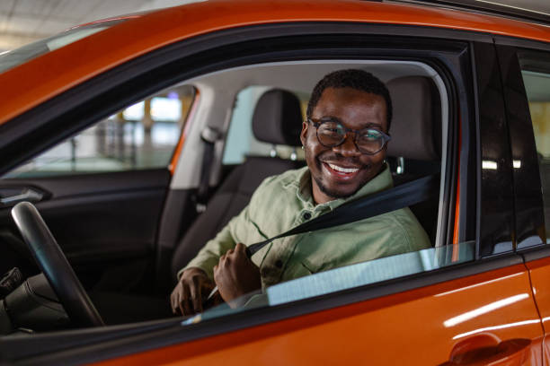 istock Safety first! A Black man is fastening a seat belt. 1852806776