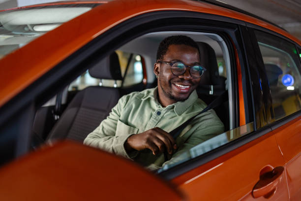 Young African American man starting a car ride