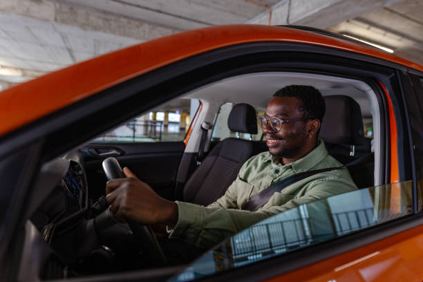 istock Young Black man leaving a garage with his car 1852807700