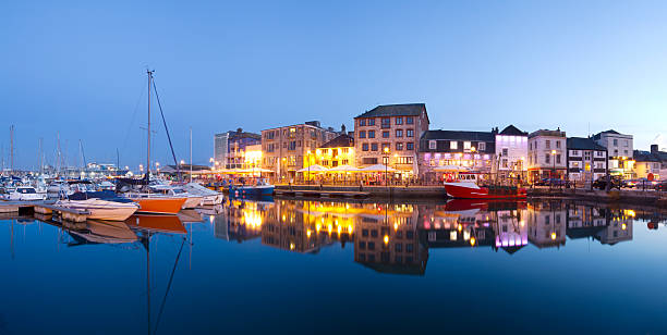 Plymouth Barbican A tranquil scene of Plymouth Barbican captured at twilight.The image shows the harbour with bars and restaurants at the waters edge. A popular location for city residence and tourists. More photographs from Plymouth in my portfolio here - devon photos stock pictures, royalty-free photos & images
