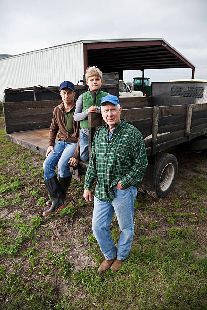 istock Three generations of men working on family farm 185280925