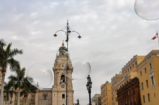 Pov of a person watching bubbles in Lima's Plaza Mayor.