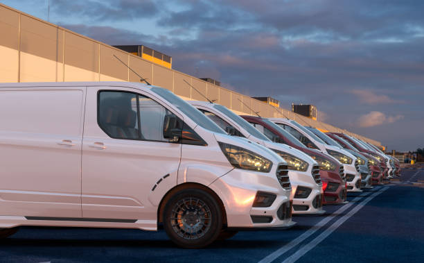 istock row of generic cargo vans in the parking lot 1852813048