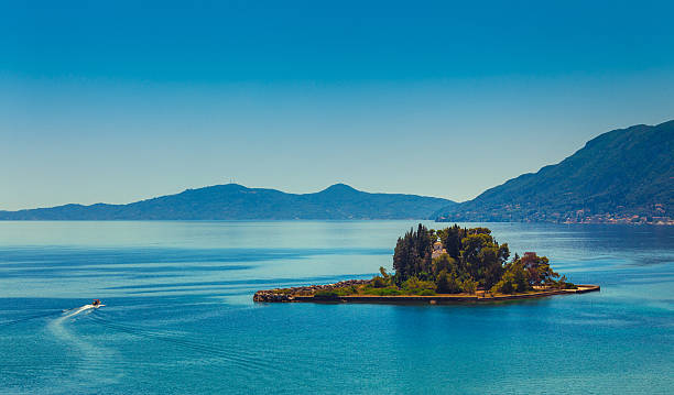 Corfu Island scenics Mouse island (Pontikonisi) and mountains of Corfu, Greece corfu stock pictures, royalty-free photos & images