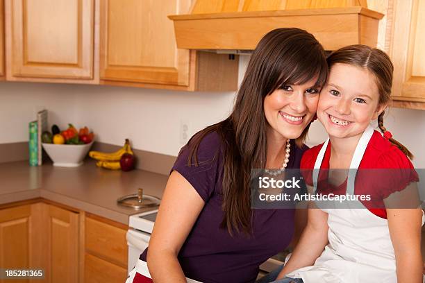 Happy Young Mother And Her Daughter In The Kitchen Together Stock Photo - Download Image Now