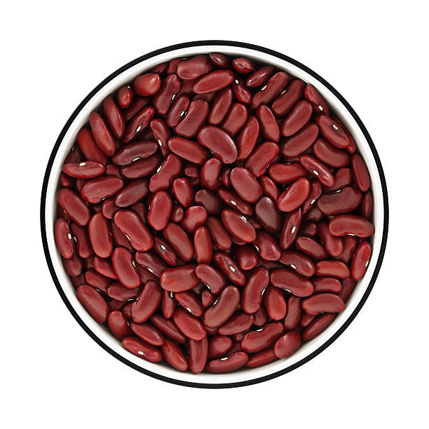 red kidney beans in wooden spoon isolated on white background.