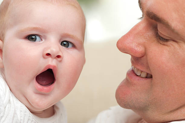istock Loving father holding his tired baby 185281893