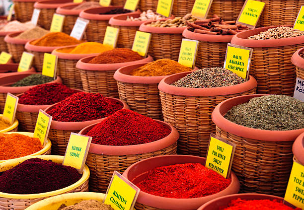 Spice market with baskets filled with spices Spices for sale at the street market in Turkey sumac spice stock pictures, royalty-free photos & images