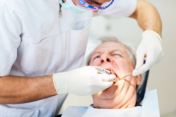 istock Senior man at the dentist,team working 185282658